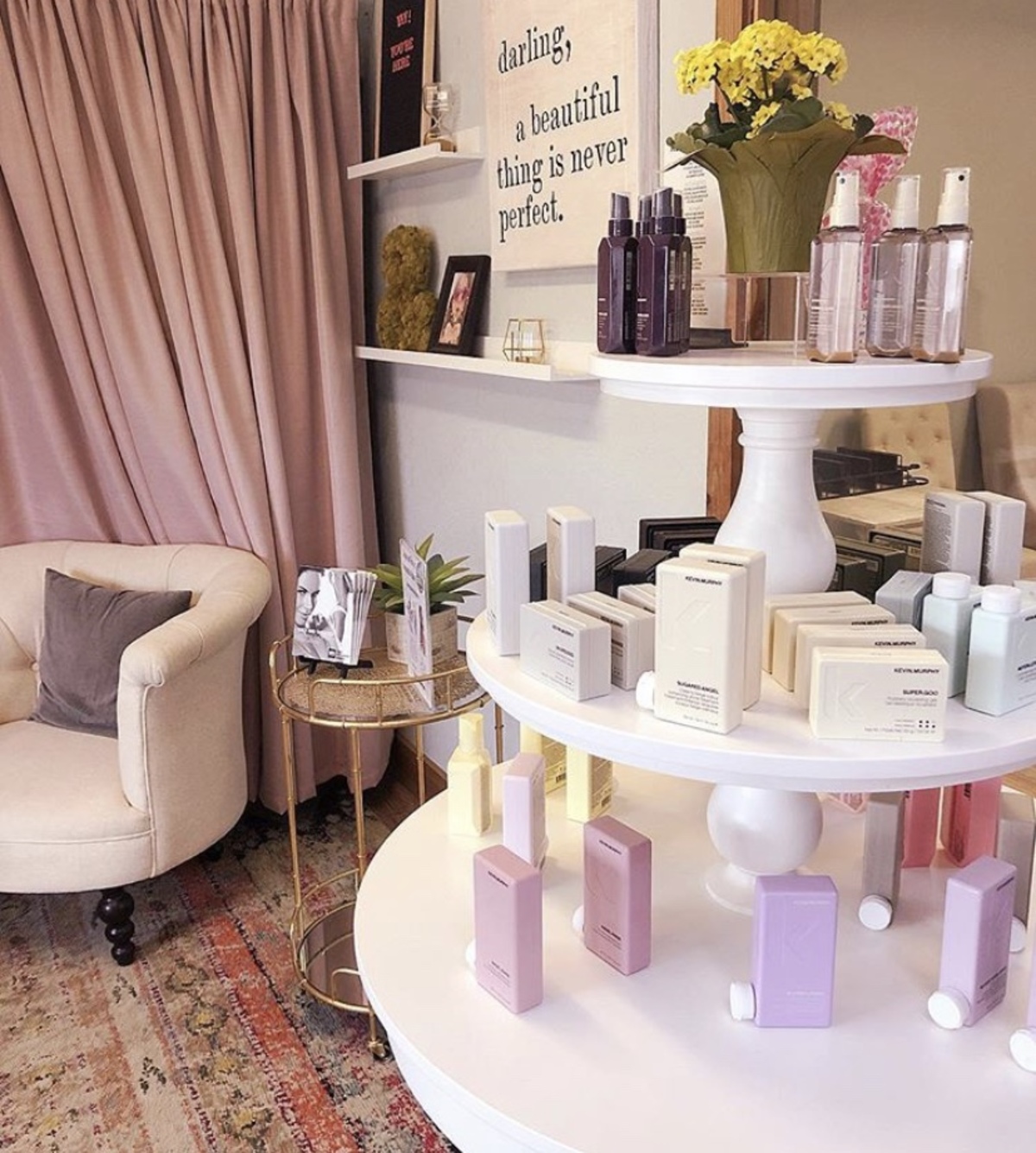 Salon interior with blush curtains and product display